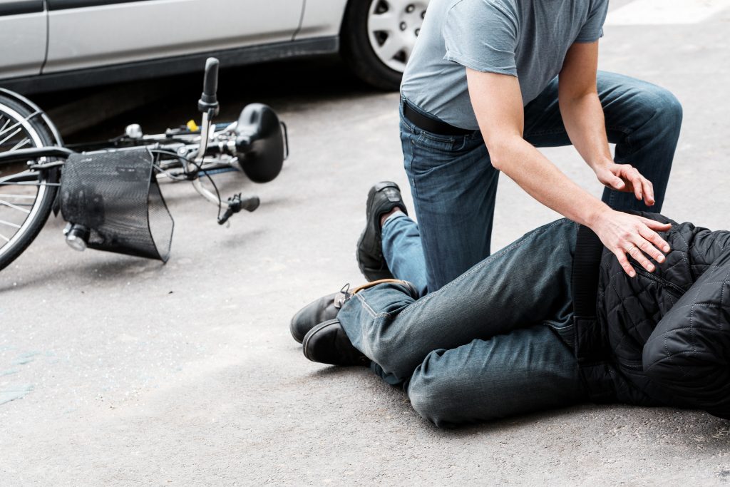 pedestrian helping bicycle accident victim in gainesville florida - the eberst law firm